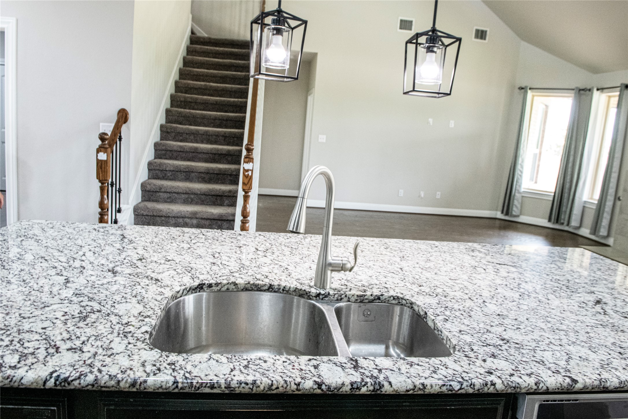 2260 Hat Bender Loop Round Rock, TX 78664 - Photo 29 of 40 a kitchen with kitchen island granite countertop a sink and a stove