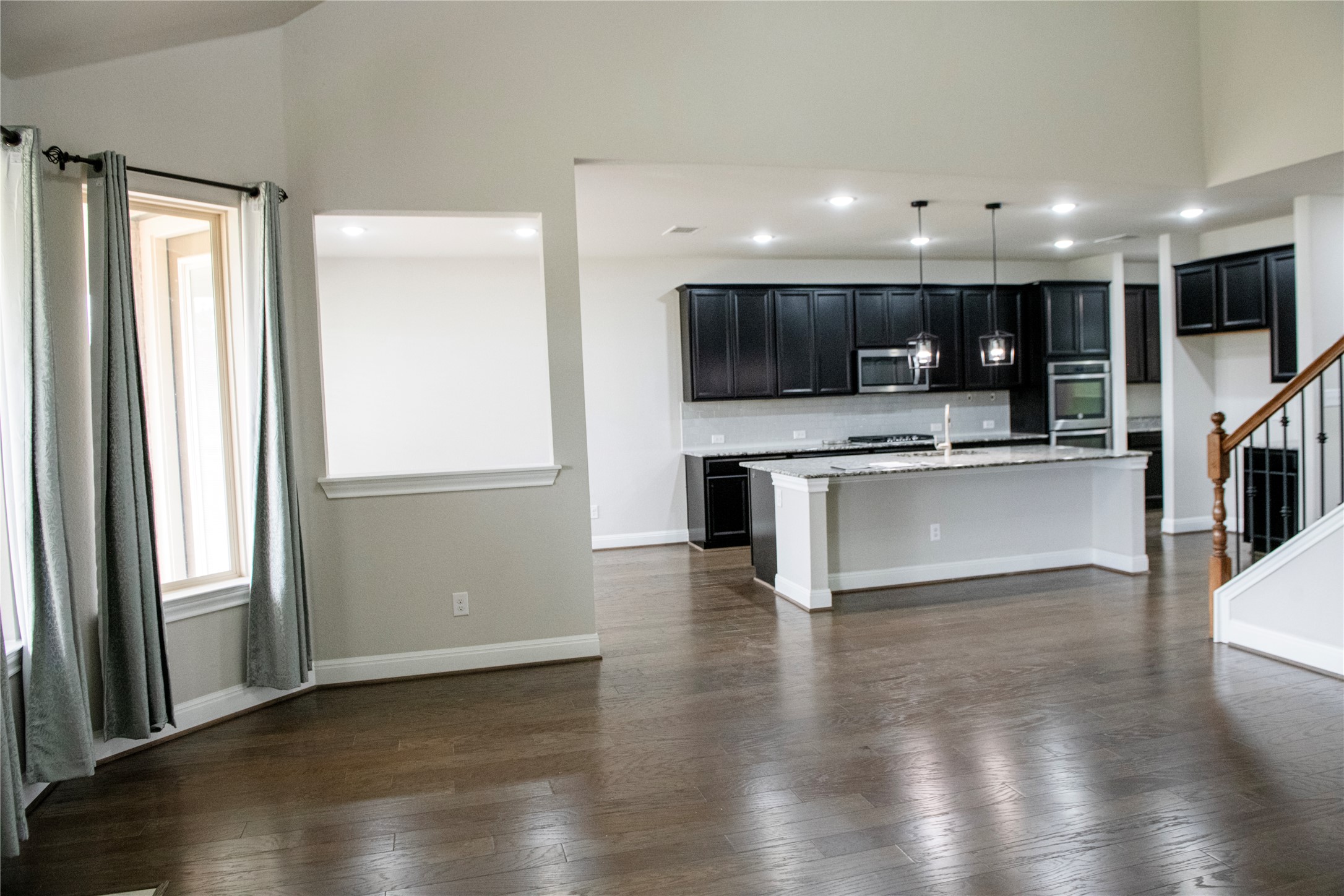 2260 Hat Bender Loop Round Rock, TX 78664 - Photo 6 of 40 a view of kitchen with cabinets and wooden floor