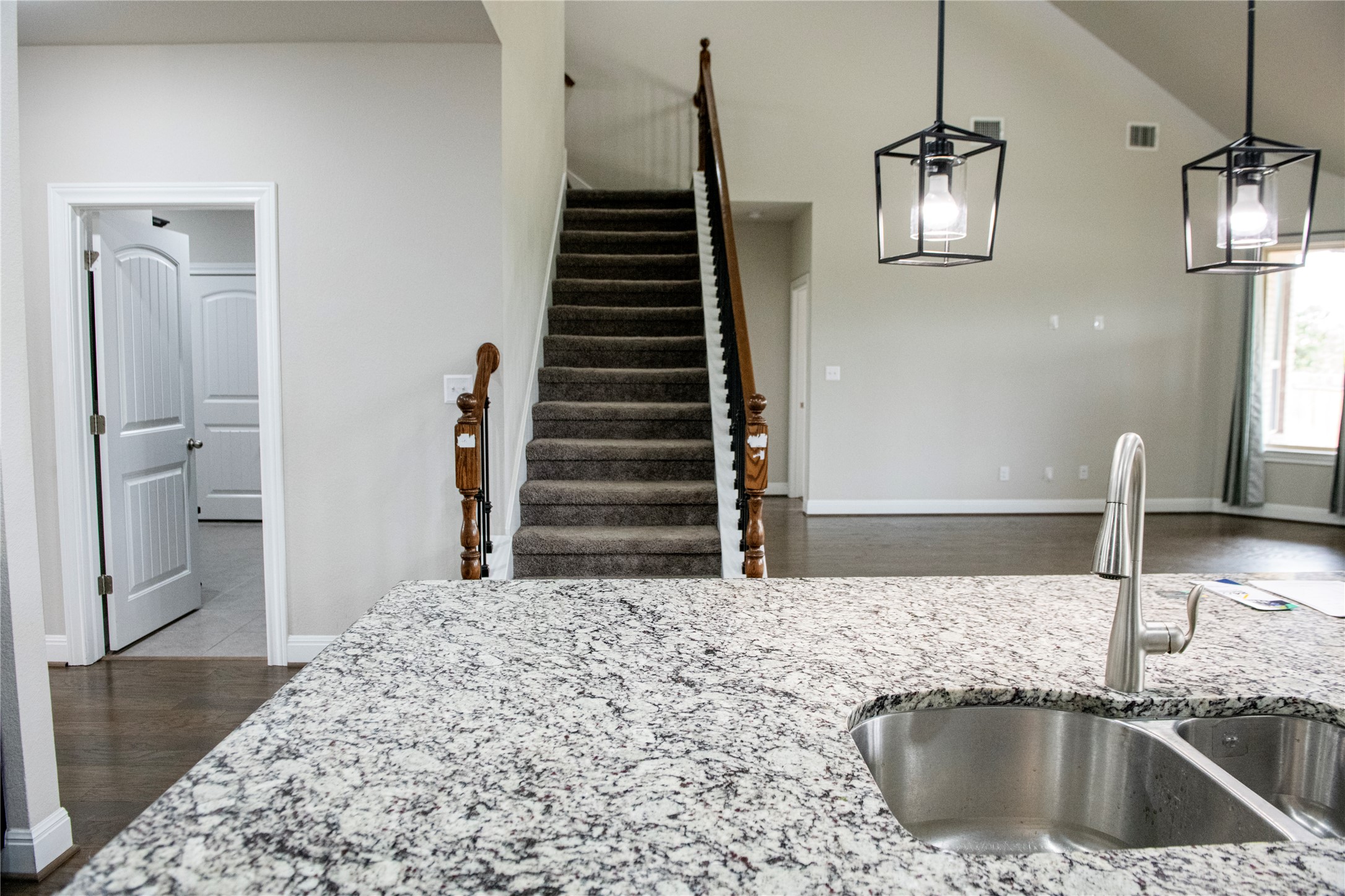 2260 Hat Bender Loop Round Rock, TX 78664 - Photo 8 of 40 a kitchen with a sink a refrigerator and cabinets
