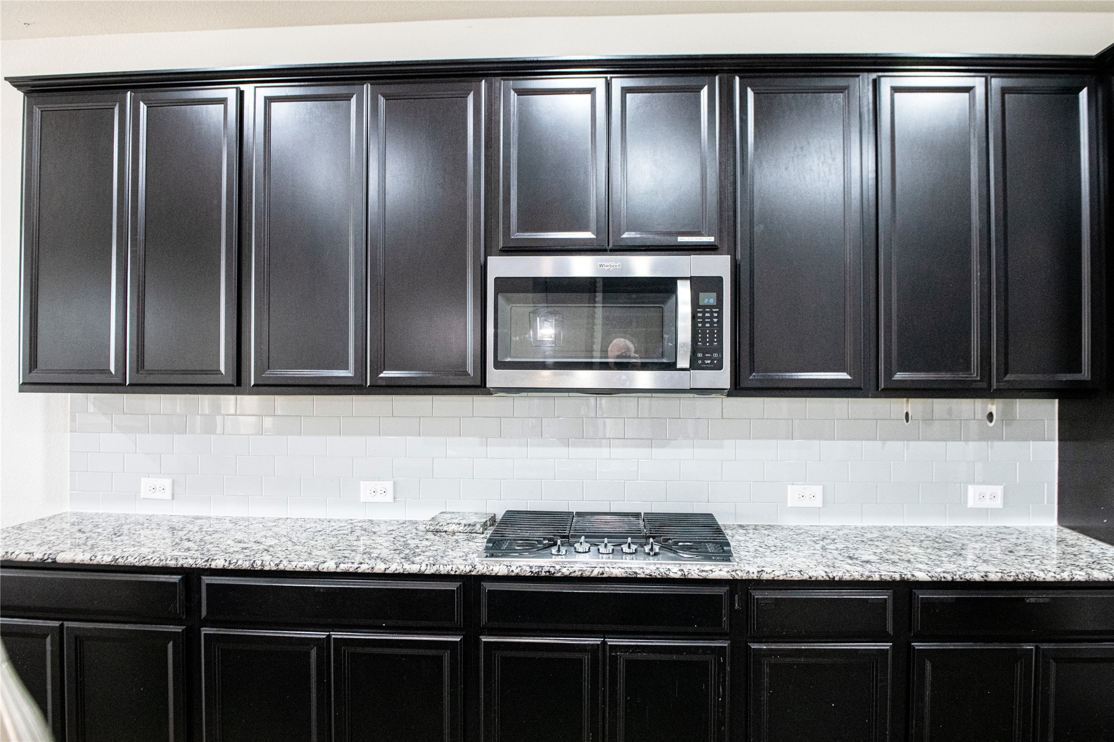 2260 Hat Bender Loop Round Rock, TX 78664 - Photo 9 of 40 a kitchen with granite countertop stainless steel appliances wooden cabinets a refrigerator and a sink