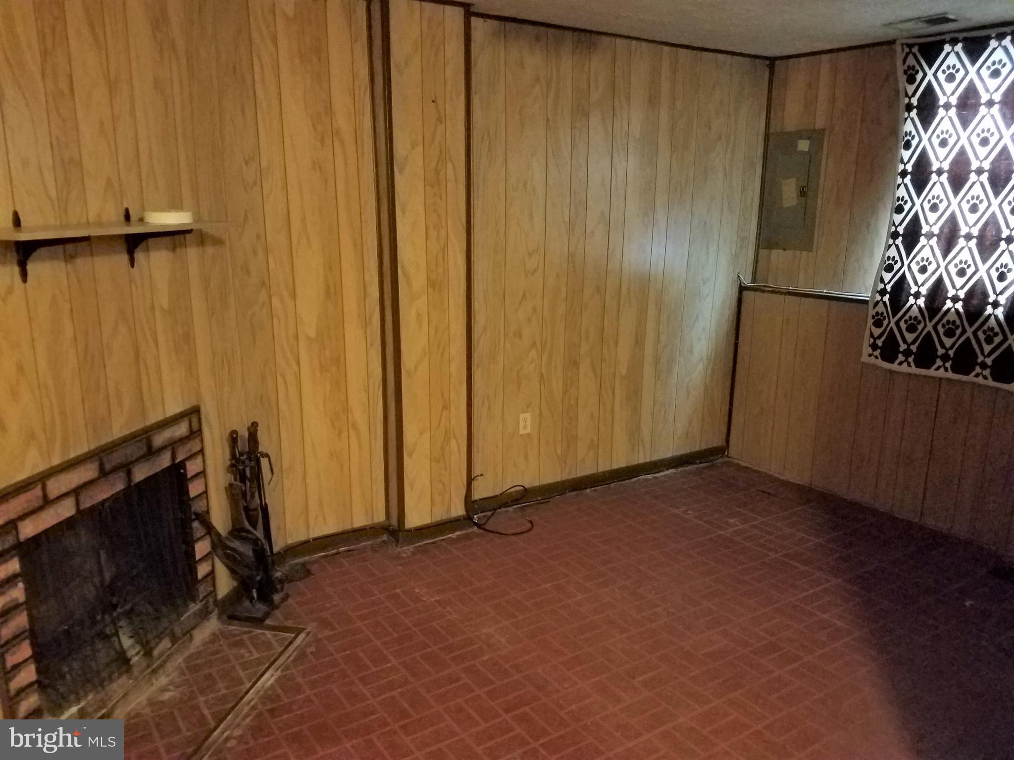 8906 Trimble Way Rosedale, MD 21237 - Photo 18 of 25 Lower Level Family Room with Wood Fire Place