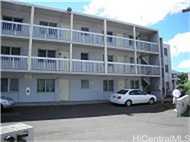 835 Puuhale Road, Unit 203 Honolulu, HI 96819 - Photo 1 of 1 a couple of cars parked in front of a building