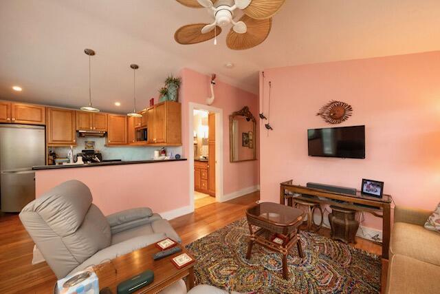 1218 Packer Street, Unit REAR Key West, FL 33040 - Photo 5 of 22 a living room with furniture and a flat screen tv