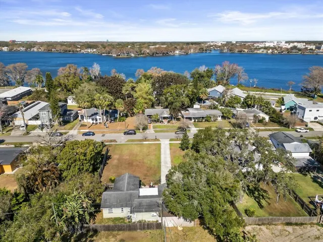 an aerial view of a houses with ocean view
