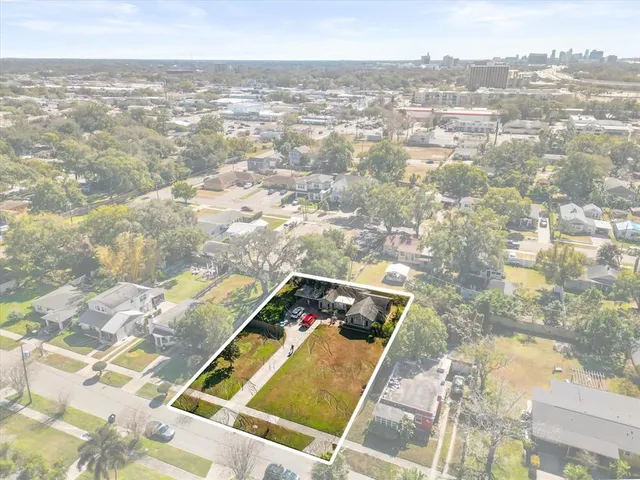 an aerial view of residential building and lake