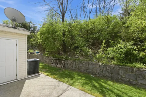 a backyard of a house with lots of green space