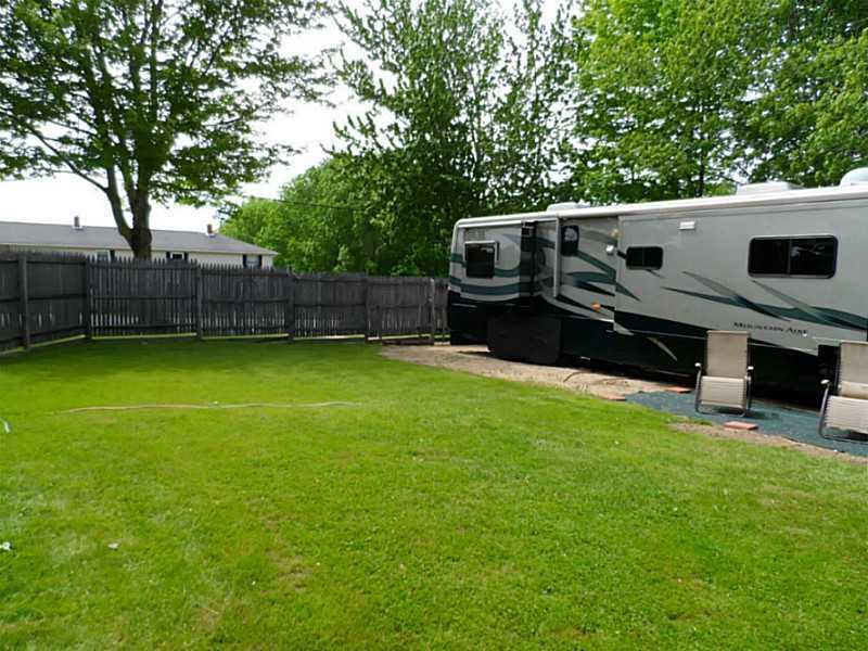 235 Ridge Road Lisbon, ME 04252 - Photo 24 of 33 Exterior Side View. Side yard -...