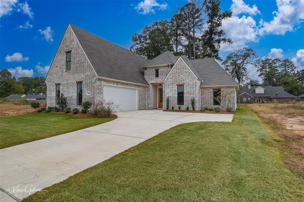 192 St Andrews Benton, LA 71006 - Photo 1 of 26 a front view of house with yard and green space