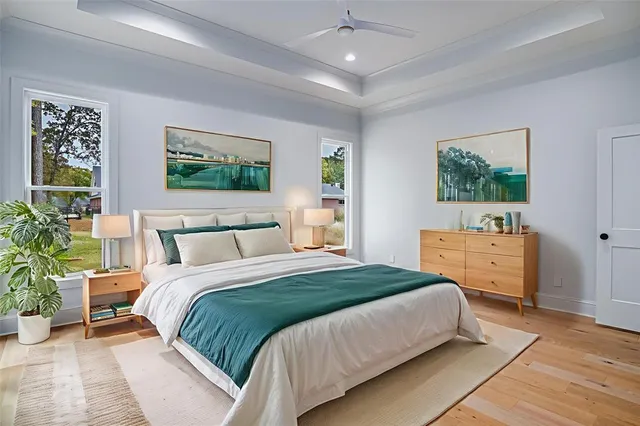 a bedroom with a large bed and a window