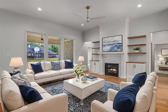 a living room with furniture and a fireplace