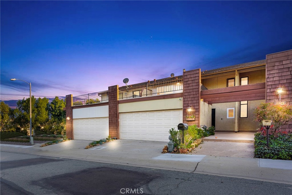 a front view of a building with garden