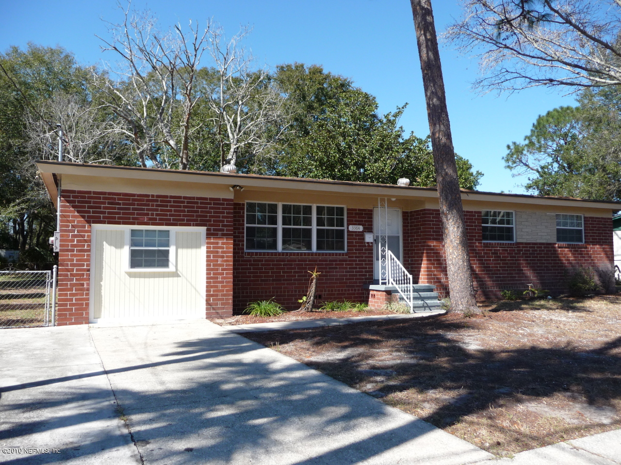3384 Rogero Road Jacksonville, FL 32277 - Photo 1 of 17 a view of house with backyard space and balcony