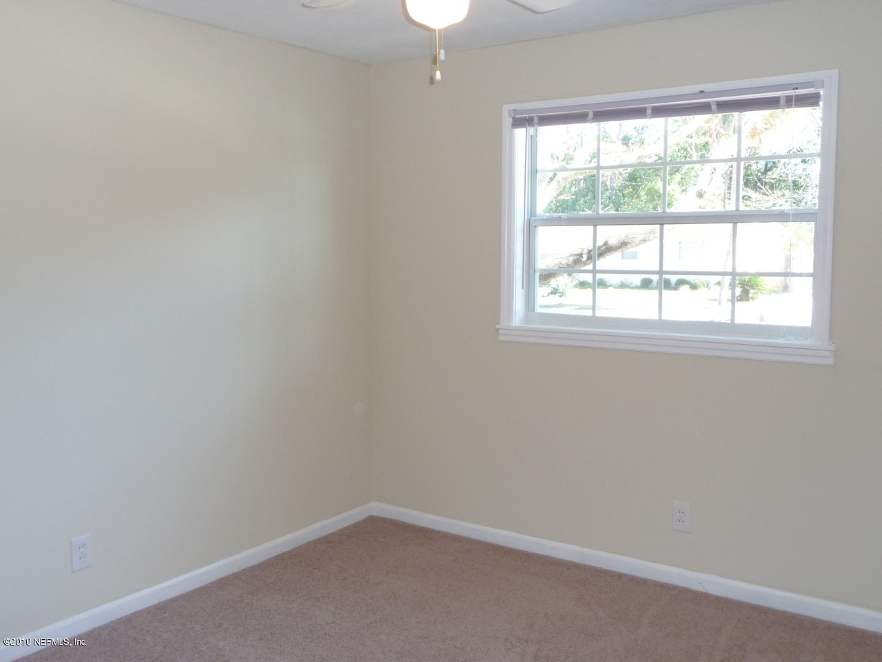 3384 Rogero Road Jacksonville, FL 32277 - Photo 11 of 17 an empty room with a window