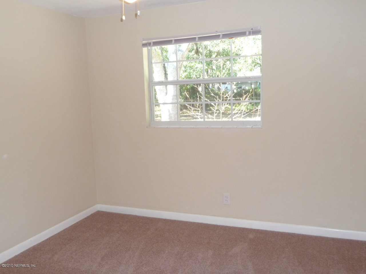 3384 Rogero Road Jacksonville, FL 32277 - Photo 12 of 17 an empty room with a window