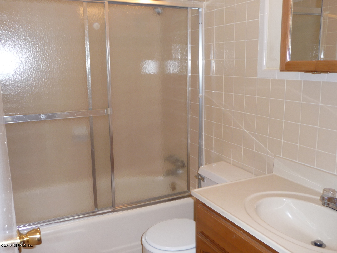 3384 Rogero Road Jacksonville, FL 32277 - Photo 14 of 17 a bathroom with a sink and a mirror
