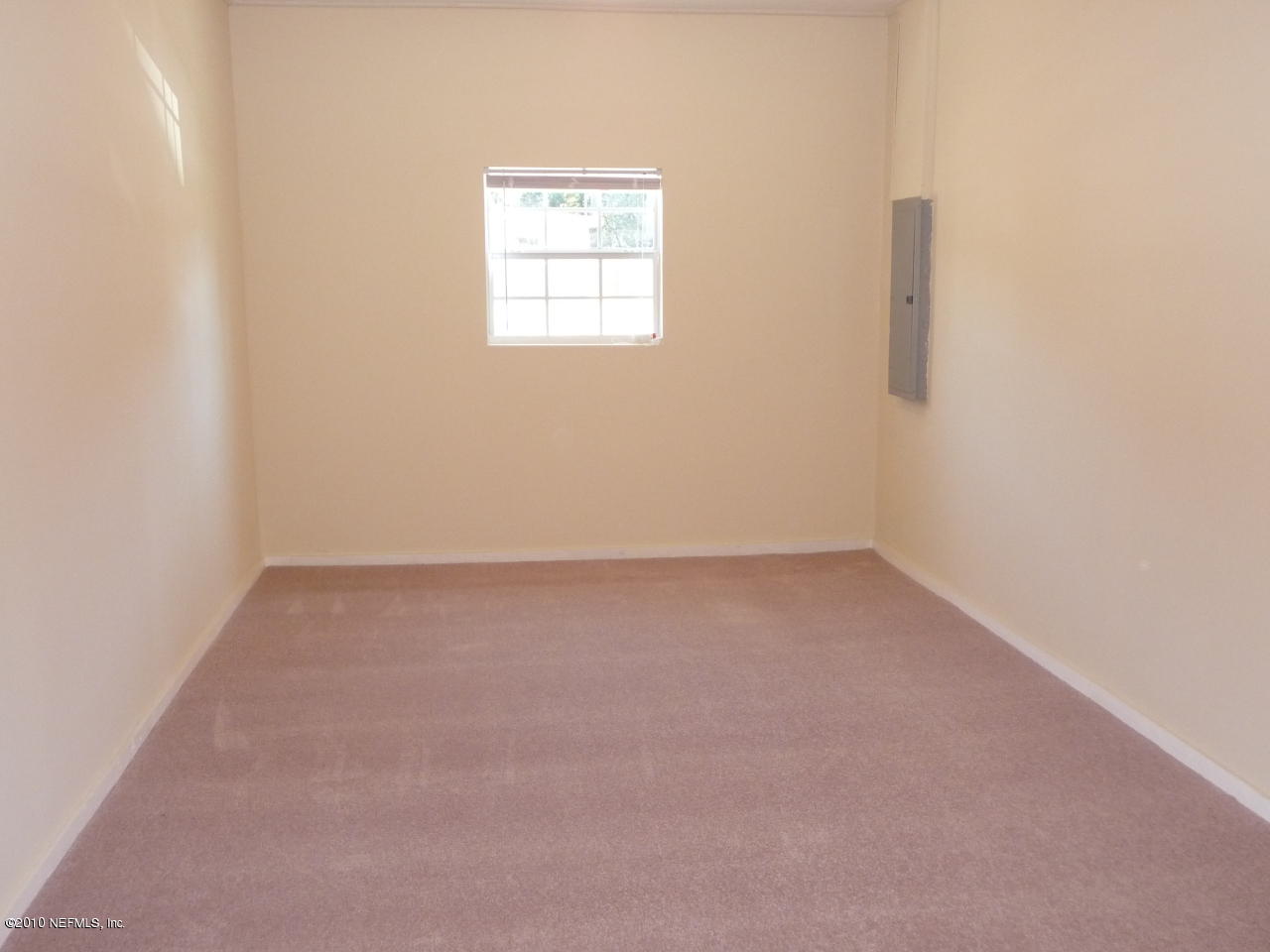 3384 Rogero Road Jacksonville, FL 32277 - Photo 15 of 17 an empty room with a window