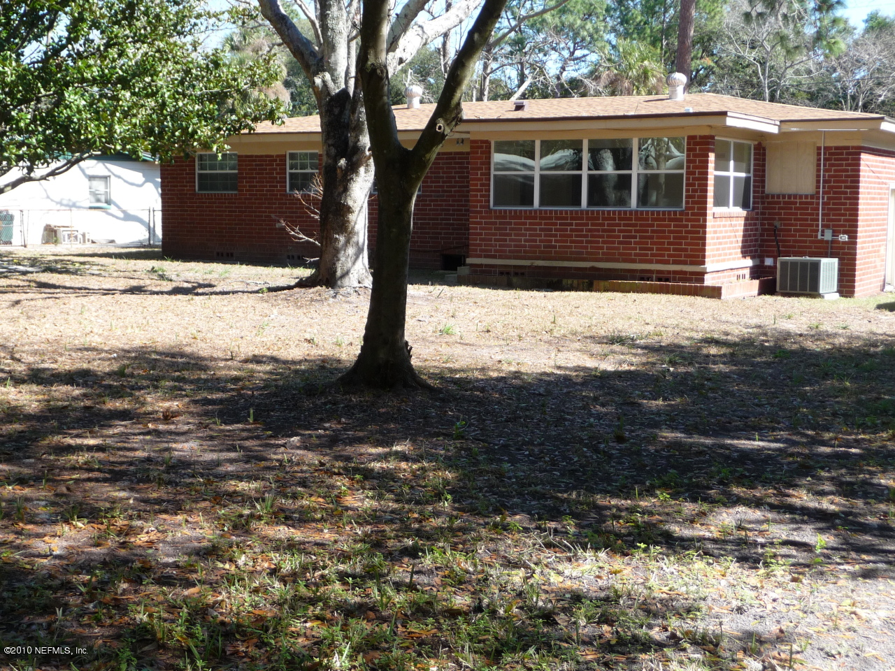 3384 Rogero Road Jacksonville, FL 32277 - Photo 17 of 17 a front view of a house with a yard