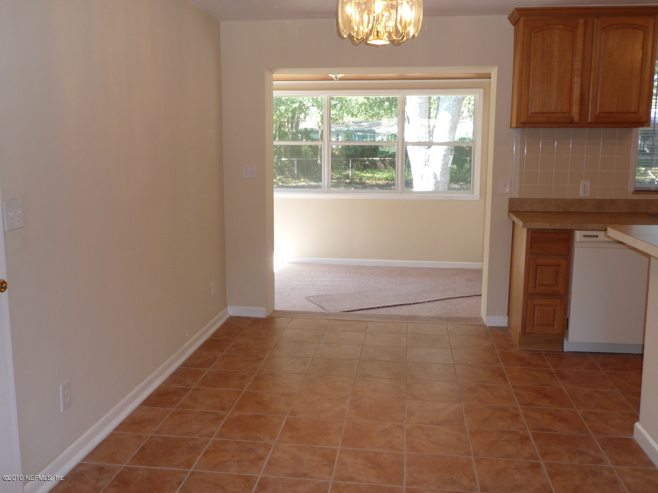 3384 Rogero Road Jacksonville, FL 32277 - Photo 7 of 17 a view of an empty room with a window