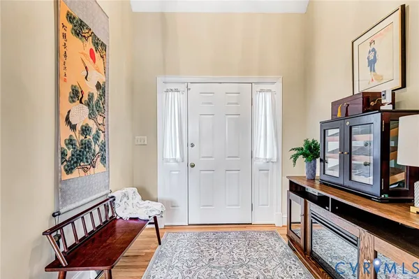 a kitchen with kitchen island granite countertop a stove top oven a sink a counter space and cabinets