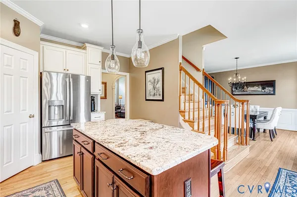 a bathroom with a granite countertop toilet sink and mirror