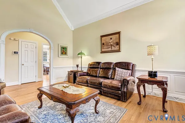 a bedroom with furniture and a ceiling fan