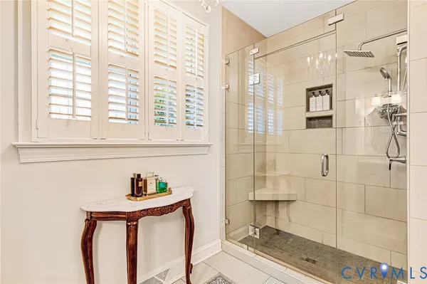 a bedroom with a bed and a table