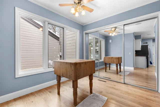 a view of a livingroom with furniture window and wooden floor
