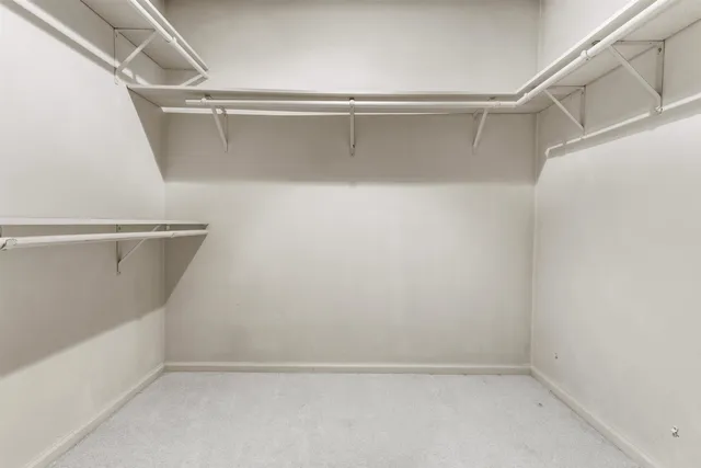 a view of an empty walk in closet