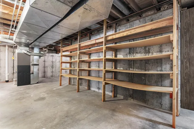 a view of an empty room with storage