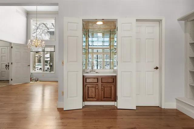 a view of an entryway with wooden floor