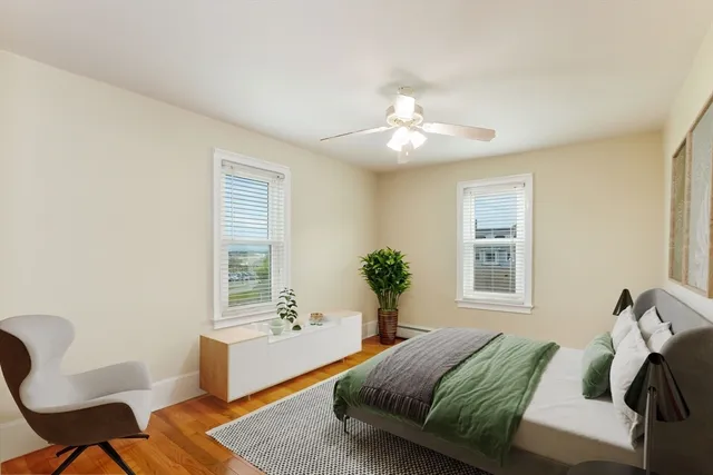 a bedroom with a large bed and a window