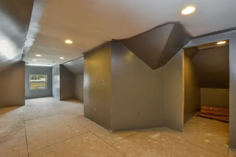 a view of a house with swimming pool and sitting area