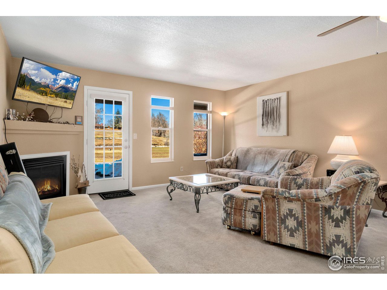 5081 Garrison Street, Unit 2 Wheat Ridge, CO 80033 - Photo 8 of 15 Living Room With Gas Log Fireplace