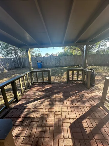 a view of a patio with wooden floor