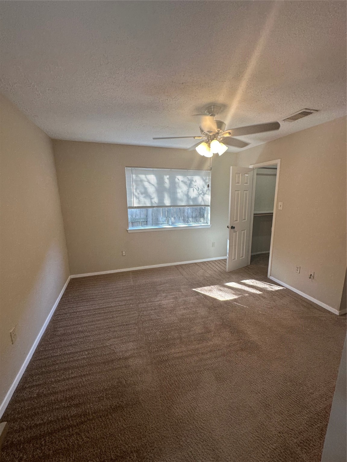 4727 Roserock Lane Spring, TX 77388 - Photo 10 of 14 an empty room with windows and fan