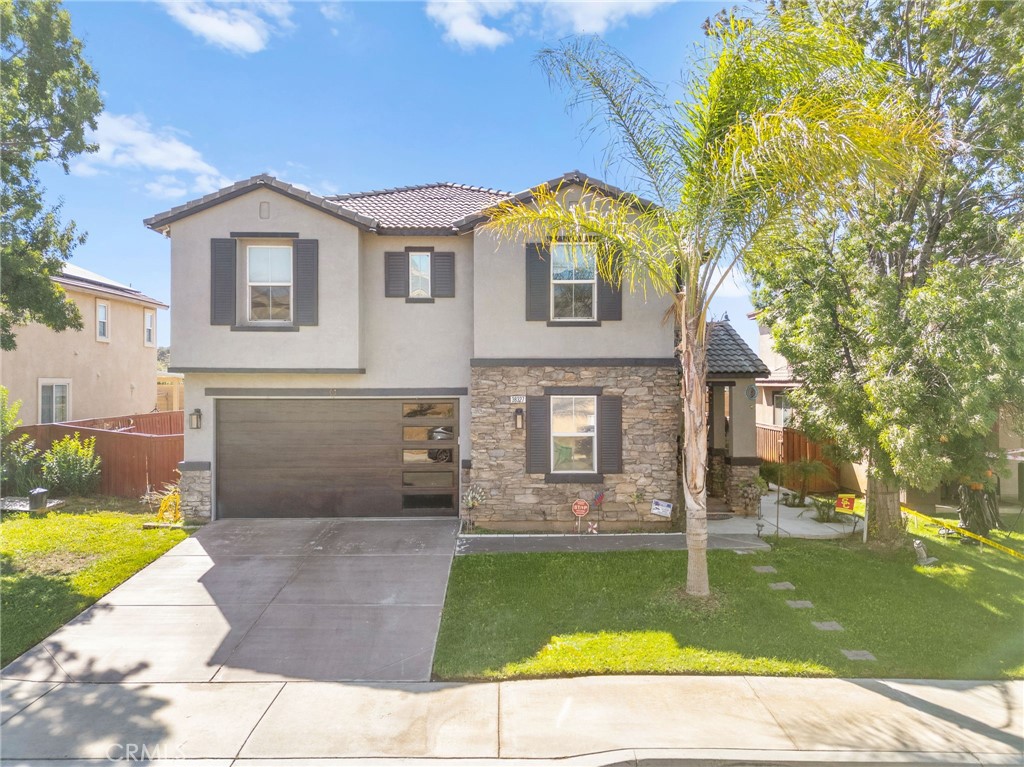 38327 Rancho Vista Drive Beaumont, CA 92223 - Photo 1 of 48 a front view of a house with garden