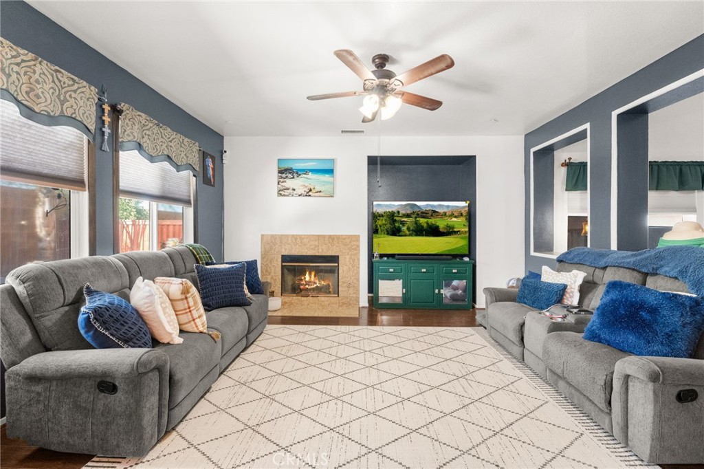 38327 Rancho Vista Drive Beaumont, CA 92223 - Photo 20 of 48 a living room with furniture and a fireplace