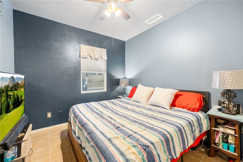 38327 Rancho Vista Drive Beaumont, CA 92223 - Photo 24 of 48 a bedroom with a bed and a window