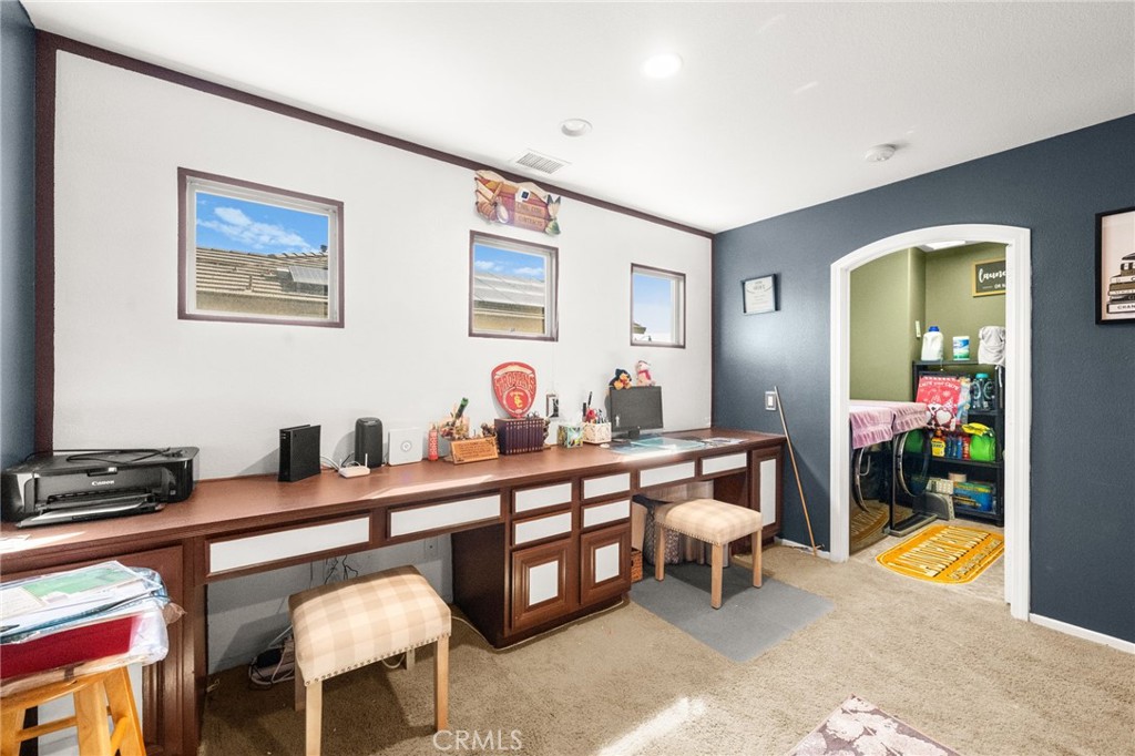 38327 Rancho Vista Drive Beaumont, CA 92223 - Photo 26 of 48 a room with furniture a rug and a window