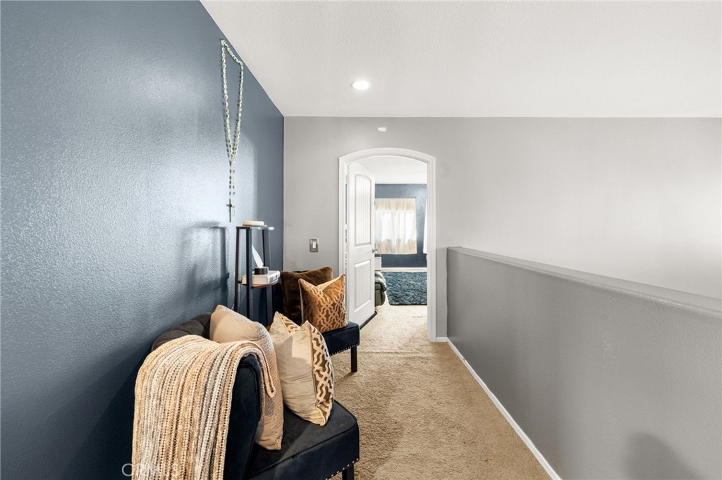 38327 Rancho Vista Drive Beaumont, CA 92223 - Photo 29 of 48 a bedroom with a bed and a mirror