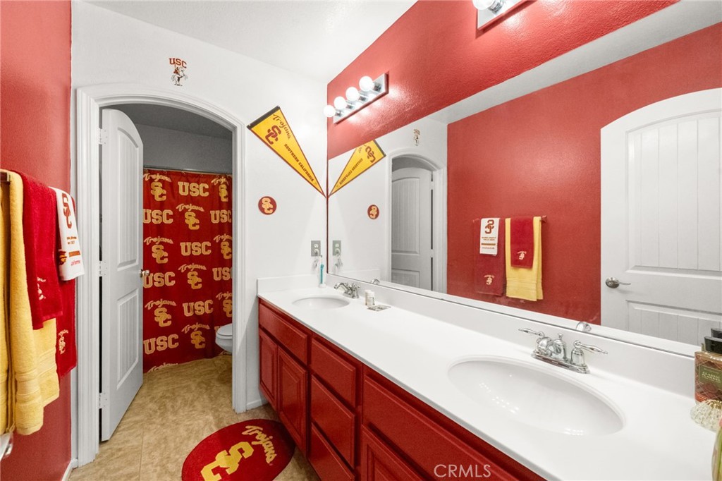 38327 Rancho Vista Drive Beaumont, CA 92223 - Photo 35 of 48 a bathroom with a sink and a mirror