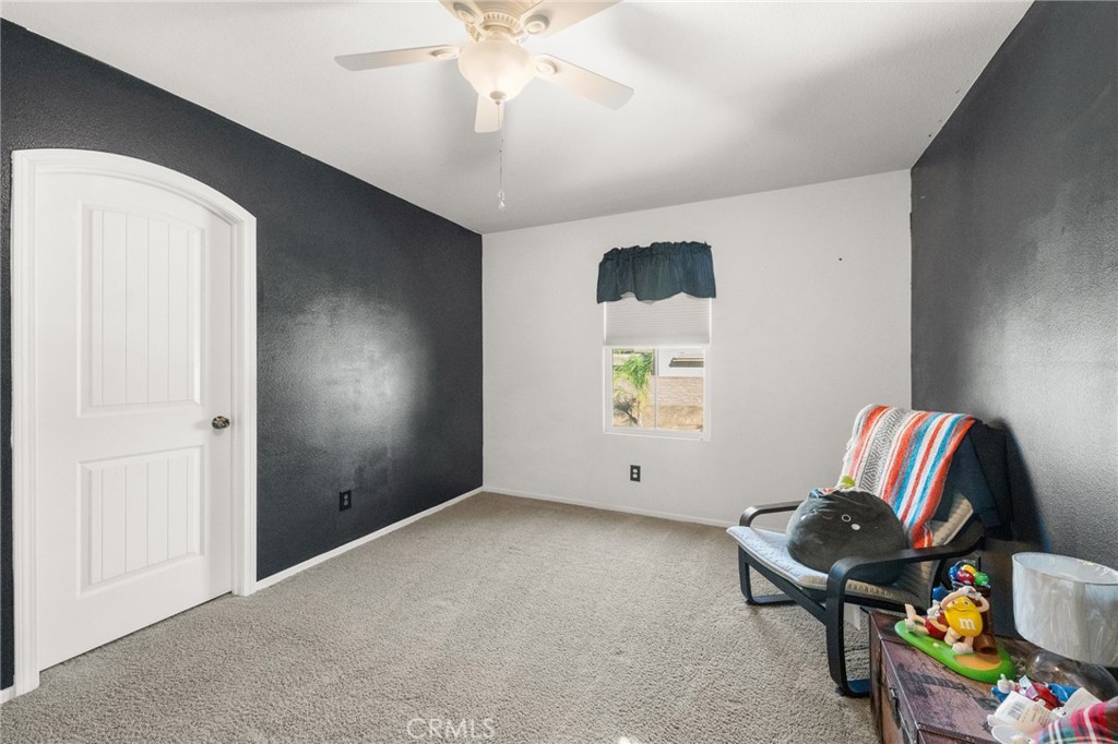 38327 Rancho Vista Drive Beaumont, CA 92223 - Photo 37 of 48 a living room with furniture and a window