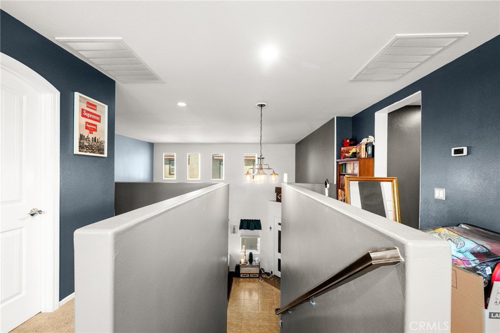 38327 Rancho Vista Drive Beaumont, CA 92223 - Photo 40 of 48 a view of a kitchen with furniture and wooden floor