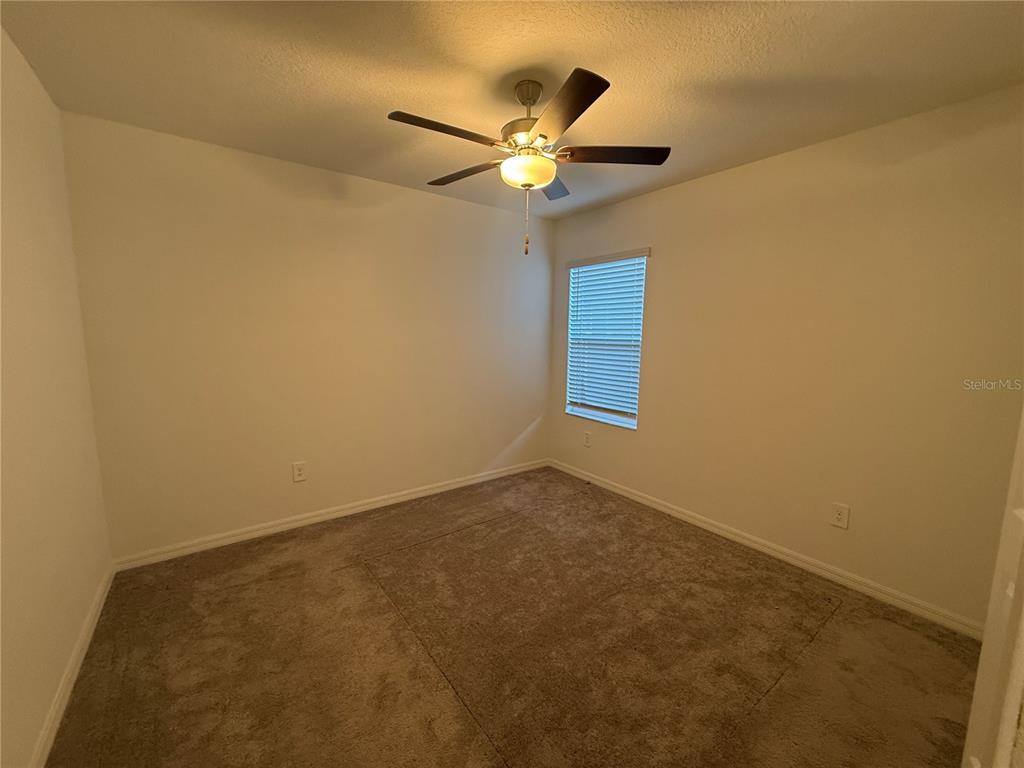 2881 Silver Scallop Loop Wimauma, FL 33598 - Photo 7 of 17 a view of an empty room