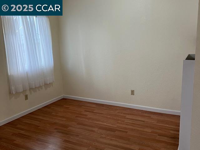 3641 Clayton Road, Unit 34 Concord, CA 94521 - Photo 2 of 16 a view of an empty room with wooden floor