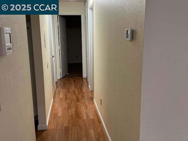 3641 Clayton Road, Unit 34 Concord, CA 94521 - Photo 4 of 16 a view of a hallway with wooden floor