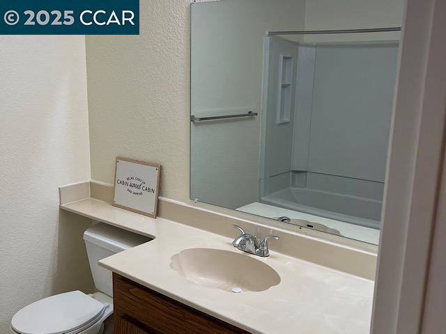 3641 Clayton Road, Unit 34 Concord, CA 94521 - Photo 9 of 16 a bathroom with a sink toilet and vanity