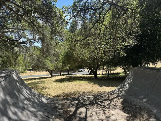 a view of a lake with trees and houses