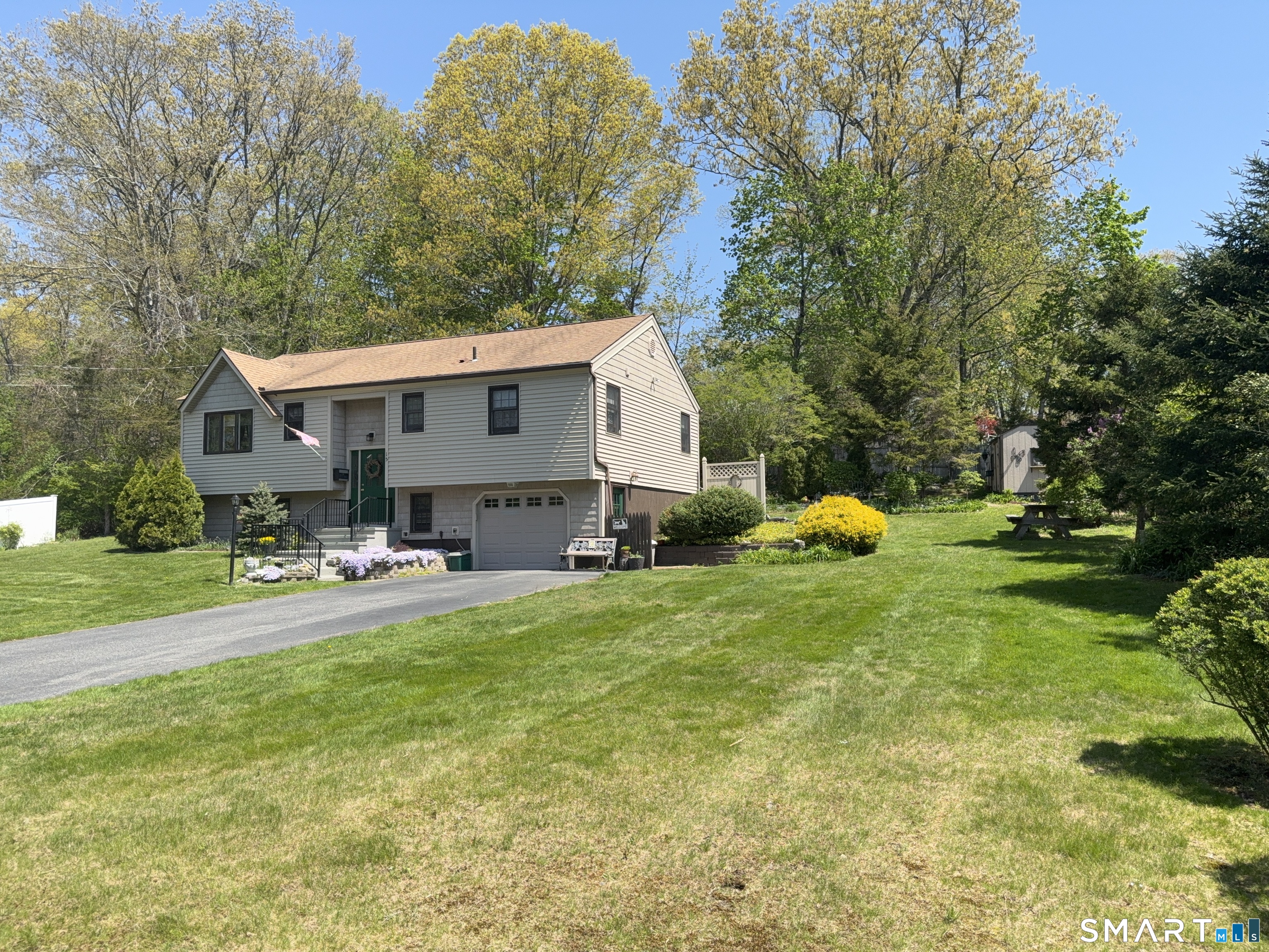 15 Grove Street Deep River, CT 06417 - Photo 25 of 25 a front view of house with garden and trees