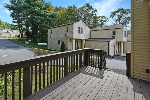 a view of a wooden deck and city view